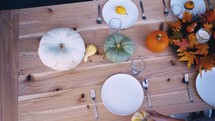 a table set for a fall dinner party 
