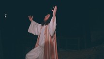 Jesus kneeling down to pray 