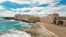Castle of Meniace in Syracusa Ortigia Island on the sea waves
