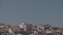 Overview of an Arab city in Israel with a large mosque rising above