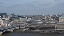 LONDON, UK—Panning view of London skyline and river Thames, including Blackfriars Bridge, Saint Paul Cathedral and the City.