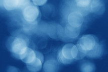 Blue bokeh lights defocused abstract background 