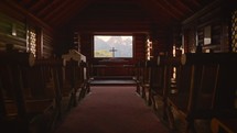 Old Wood Chapel Pews with Cross and Mountain View