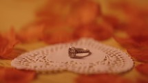 Valentine's Day engagement ring on a heart shaped cloth