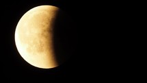 Red moon seen with telescope during lunar eclipse