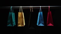 Black Friday shop with hanging shopping bags 