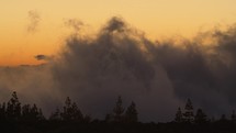 Slow motion shot of clouds at sunset at Teide National Park in Tenerife, Canary Islands.