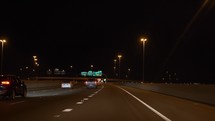 Driving POV on an interstate highway at night