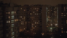 Night view of the neighbourhood with high-rise apartment blocks illuminated with window lights in the dark. Moscow. Russia
