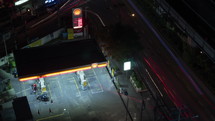 Timelapse shot of Shell petrol station working at night. Royal Dutch Shell the seventh largest company in the world as of 2016, in terms of revenue