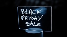 Black friday Sale sign moving with dark background