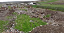 Aerial Drone shot of Landscape Of A Dump Hill Near Abandoned Buildings On Countryside. 