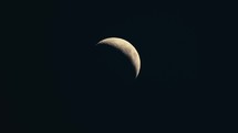 Crescent moon in the dark night sky