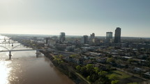 Aerial View of the Little Rock, Arkansas Skyline. Drone view flying over Arkansas River near downtown Little Rock.
