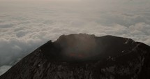 Aerial orbit of active Fuego Volcano Crater in Guatemala	