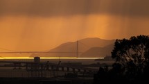 Timelapse of light rays moving across the golden gate bridge in San Francisco city