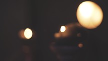 flickering candles in darkness 