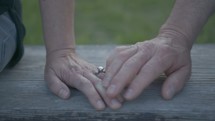 a couple touching hands 