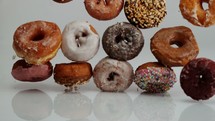 falling donuts on white background