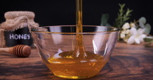 Honey poured on spoon in slow motion. 