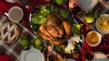 Family Toast Red Wine For Thanksgiving Day With Chicken At Table, Vertical