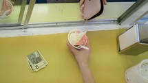 a woman ordering an ice cream 