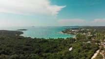 Drone circling around bay with sailboats in Istria Croatia
