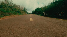 Drive a motorbike across the road markings on the island
