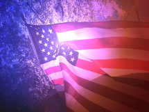 American Flag with Lens Flare and Sunlight Waving in the Wind
