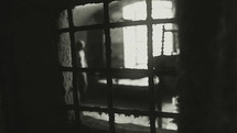 "Inside a communist prison between 1948-1989.
Black and white footage. 
The clip can illustrate Persecution of Christians in the Eastern Bloc."
