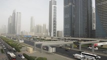 Rush hour, busy traffic, cars, vehicles on Dubai highway by metro train in United Arab Emirates in Middle East. 
