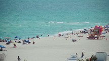 Wide Shot of People on the Beach at Mid Beach - Miami Beach, Florida