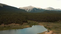 Aerial drone flying over a lake in the Colorado Rocky Mountains. 
