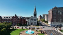 Drone footage of St. Francis Xavier College Church in St. Louis, MO on a bright and sunny day.