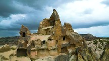 Drone aerial shot of Cappadocia Ancient architecture cave houses facade
