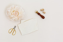 soft pink flowers and stationary 