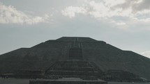 Massive Structure Of Pyramid Of The Sun Over Cloudy Sky In Teotihuacan, Mexico. Low Wide Angle