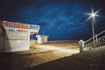 Burgar Bar on a beach at night 