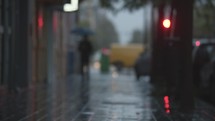 Blurry street in rainy evening