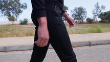 Man With Black Suit Walks