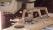 Drilling holes into wooden board