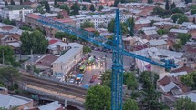 Crane and evening city time-lapse