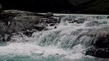 A View Of Waterfalls In Laguna Esmeralda Near Ushuaia, Tierra de Fego, Argentina. Slow Motion Shot