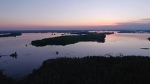 Aerial of lake and forest at dawn
