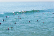the ocean full of surfers 