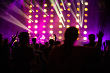 hands raised in worship during a Christian concert 