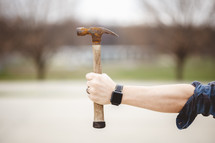 a man holding a hammer 