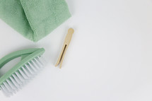 mint, brush, clothespin, and towel 