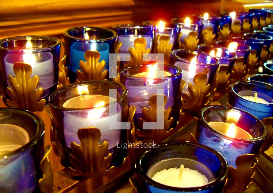 Purple and Blue Candlelight Communion during a Catholic Church service. 