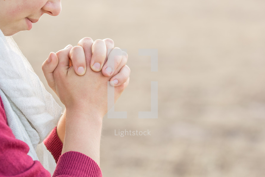 girl with praying hands 